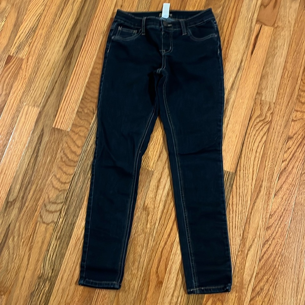 Navy jeans with 2 pockets in the front and back button in front no zipper